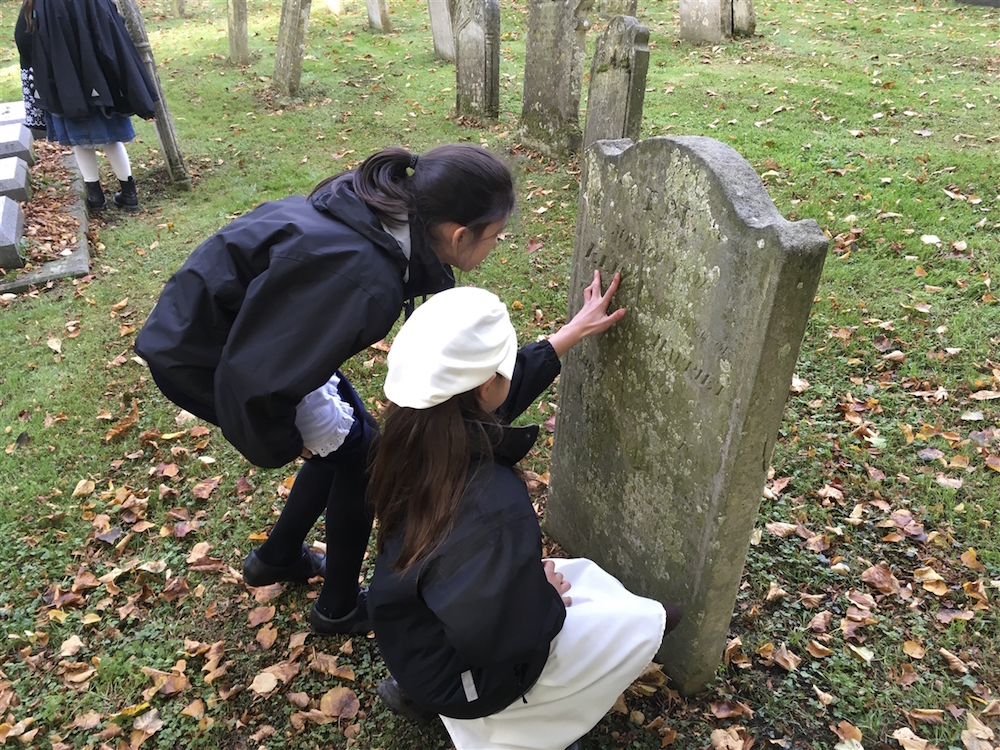 Junior historians at a grave